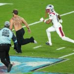 Super Bowl 60 briefly halted by fan on the field